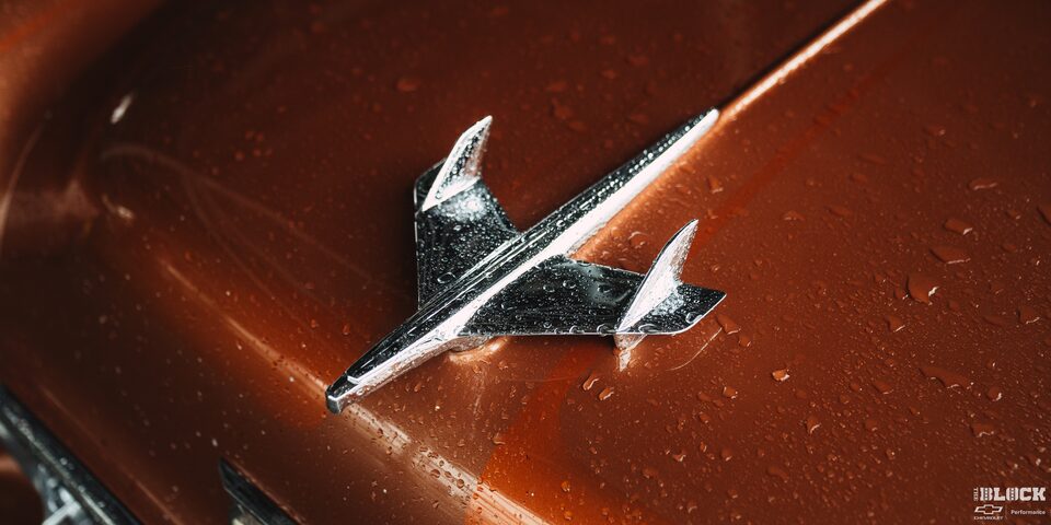 Close-up of the Steel Jet Plane Hood Emblem on a 1955 Chevy Handyman Wagon