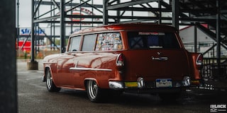Three Quarters Rear View of a Wet 1955 Chevy Handyman Wagon under Cover