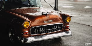 Three Quarters View of the Front Portion of an Orange 1955 Chevy Handyman Wagon