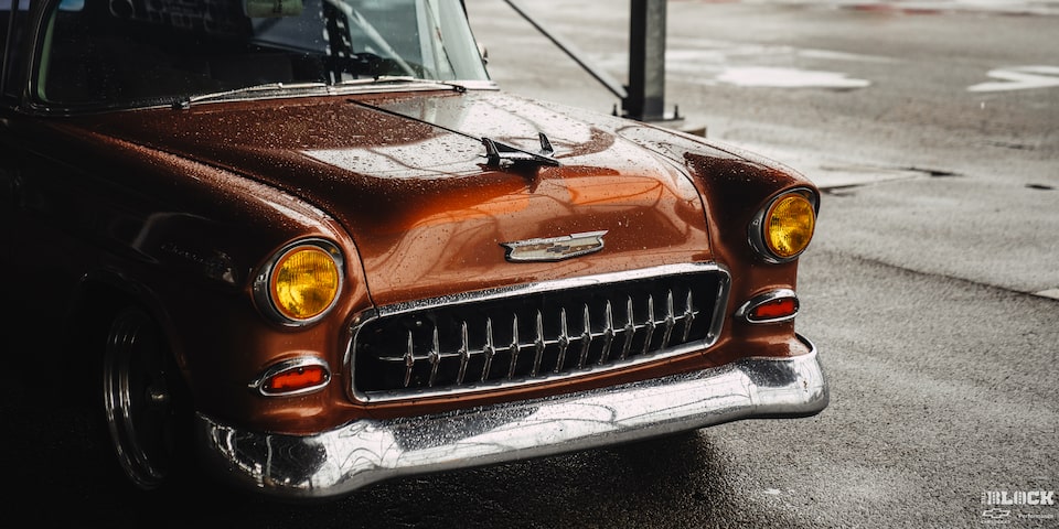 Three Quarters View of the Front Portion of an Orange 1955 Chevy Handyman Wagon