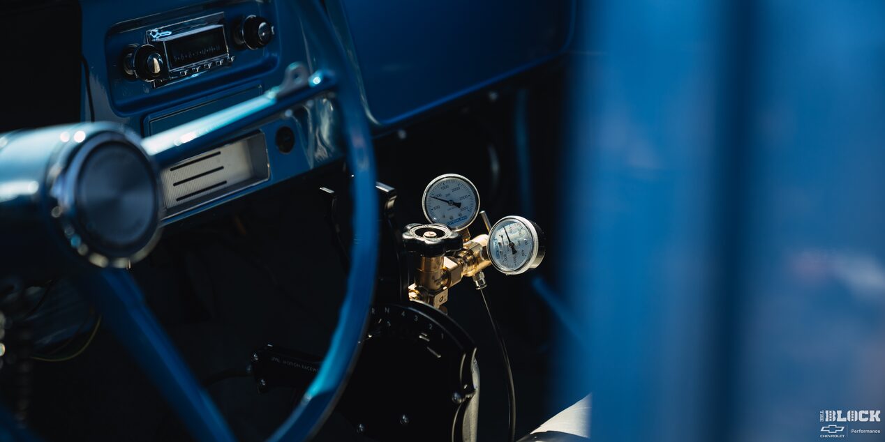 The truck’s interior features a blend of stock-appearing elements and racing components.