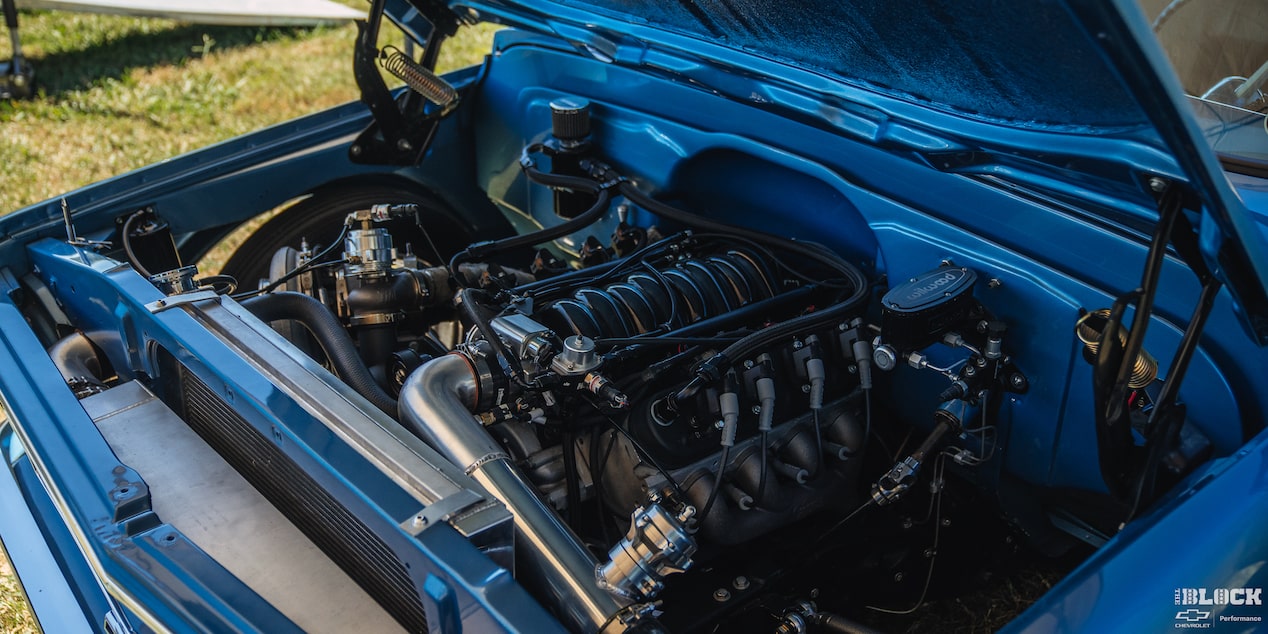 Three Quarters View of the Open Hood with the Engine of a 1967 Chevy C10 Truck Exposed