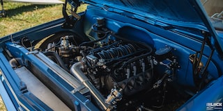 Three Quarters View of the Open Hood with the Engine of a 1967 Chevy C10 Truck Exposed