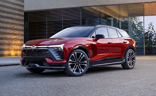 Radiant Red 2024 Chevy Blazer EV Beautifully Displayed Outside a Modern Home